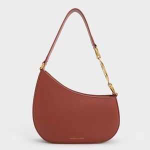 Charles & Keith Asymmetrical Crescent Shoulder Bag with Gold Hardware in Mocha
